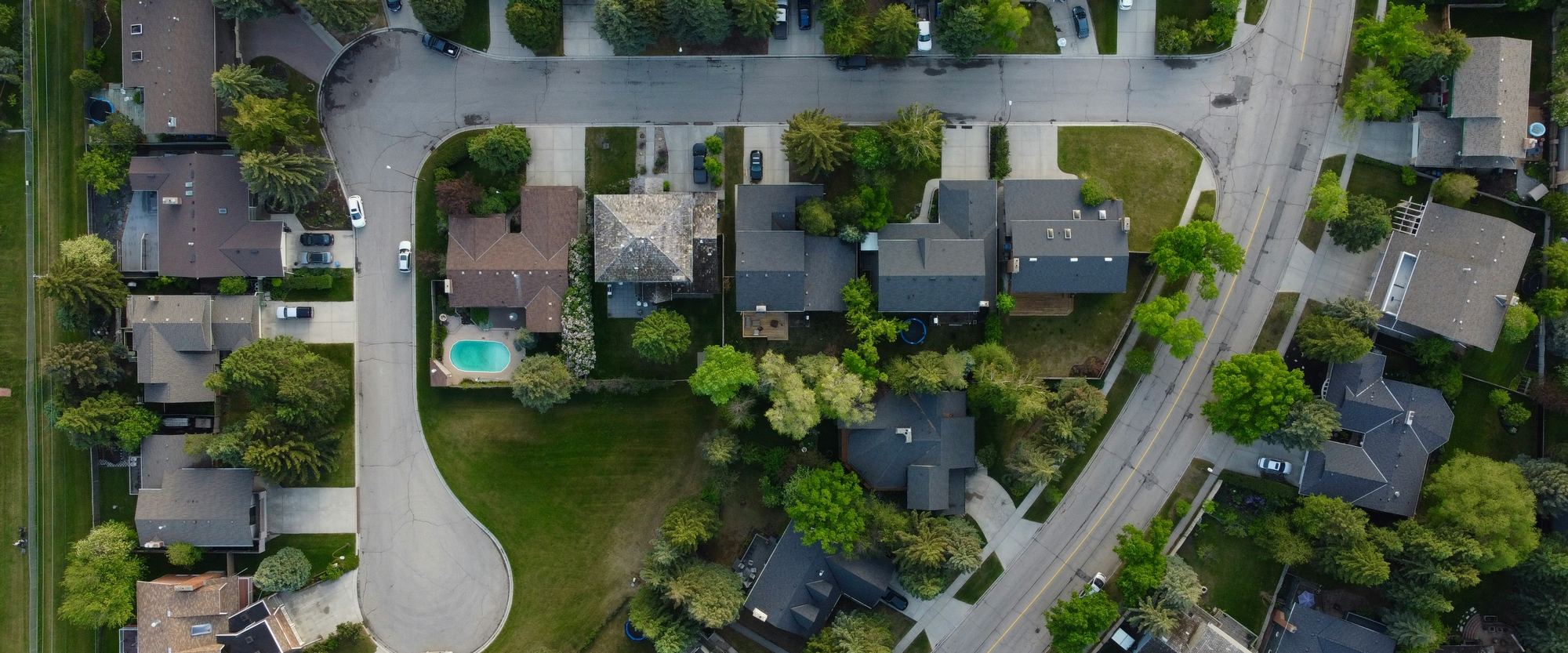 Aerial view of a Treasure Valley neighbourhood, tree-lined streets and a cul-de-sac