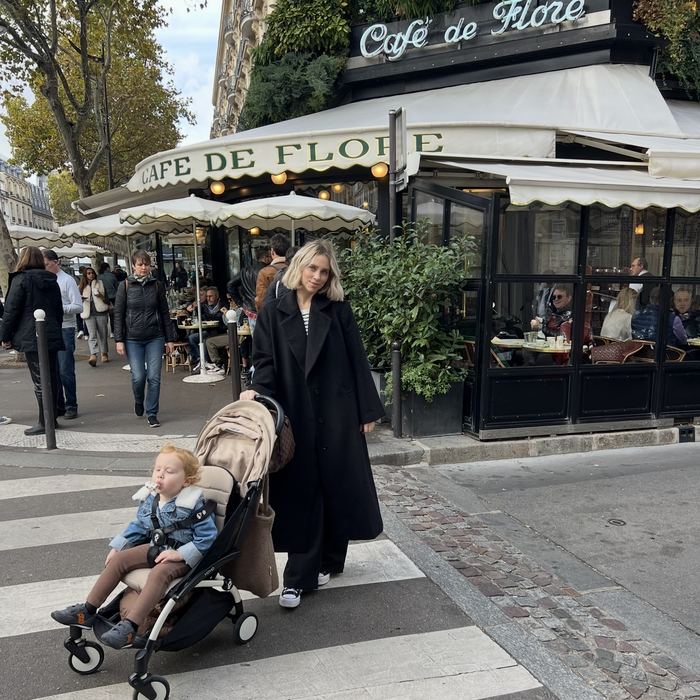 Kellie and their eldest outside Cafe de Flore, Paris